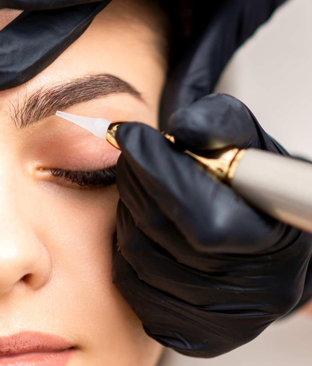 A woman receiving microblading treatment at Azure Dream MedSpa, enhancing her brows for natural-looking results.