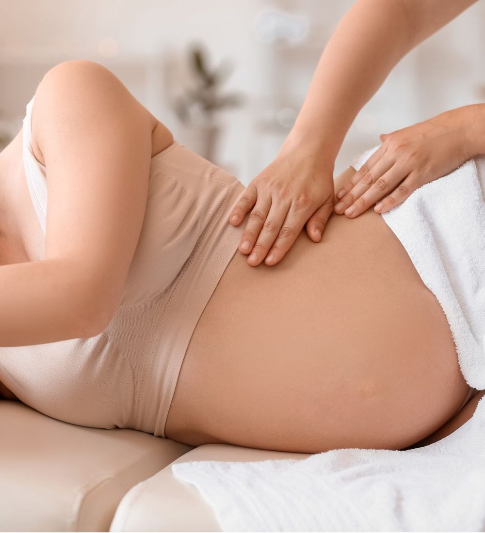 A pregnant woman getting massage at azure dream medspa